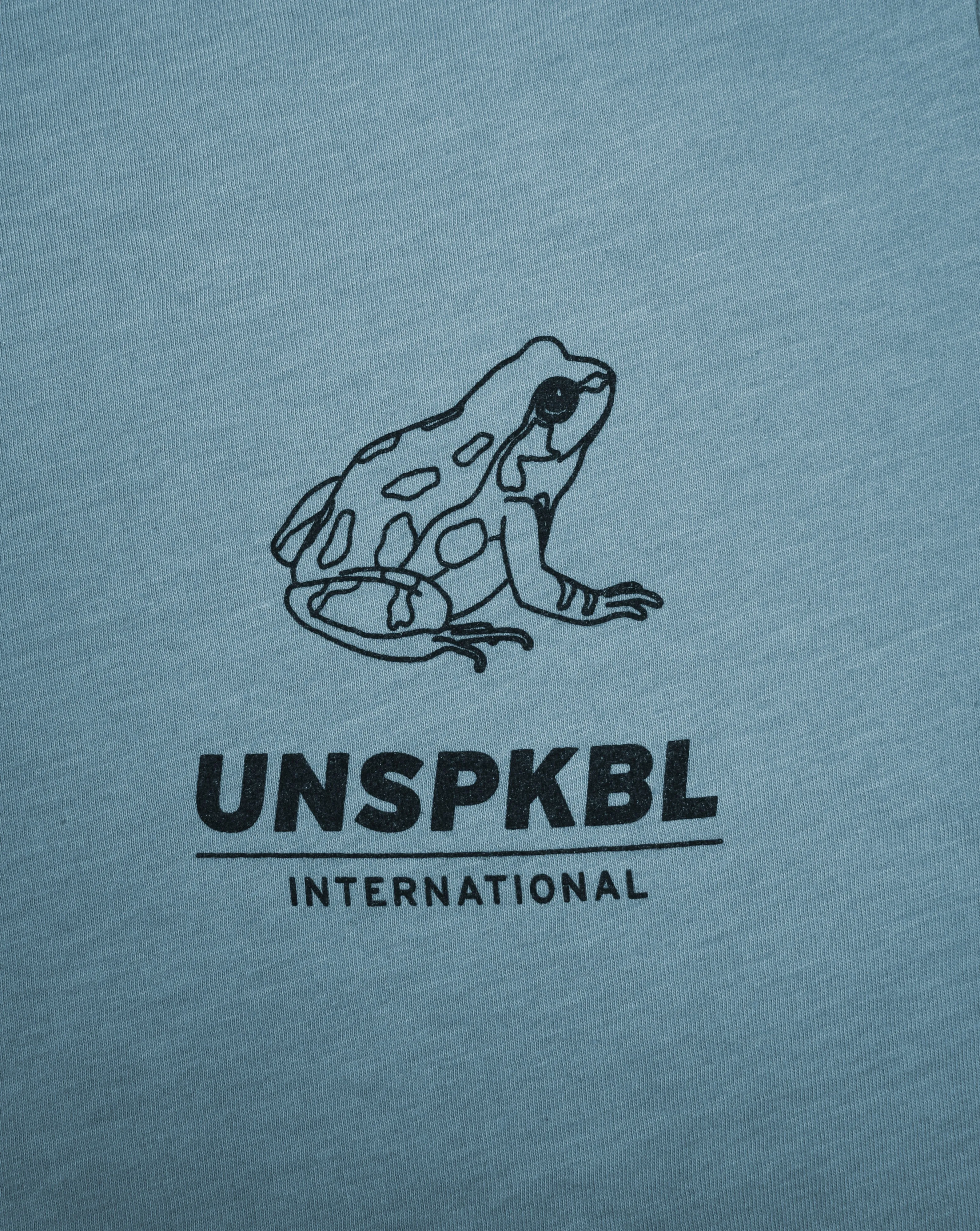 UNSPEAKABLE INTERNATIONAL T-SHIRT